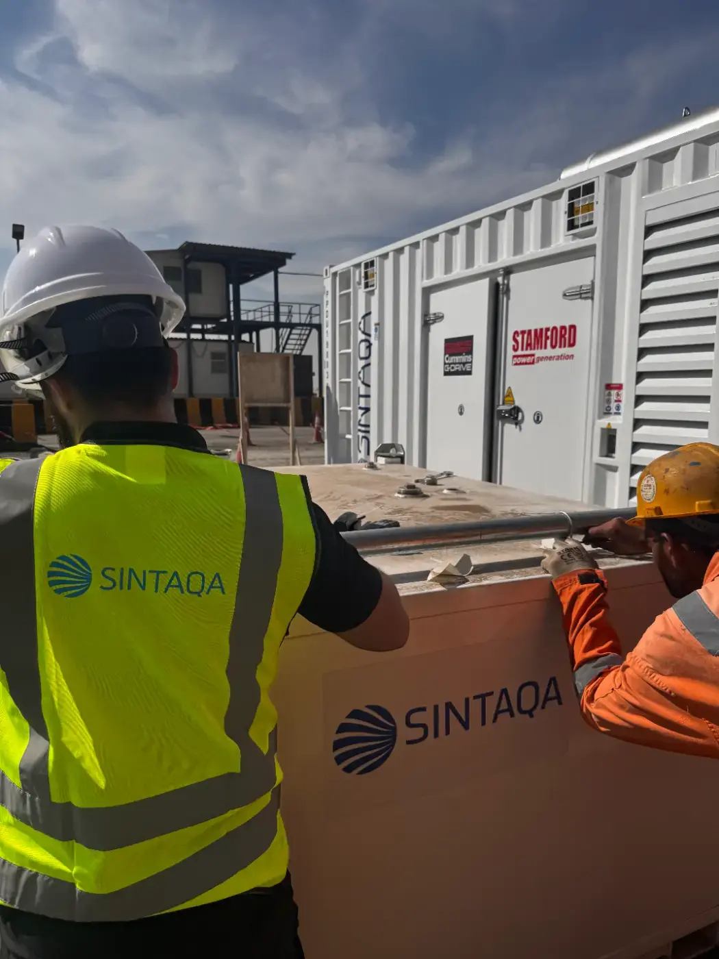 SINTAQA team inspecting a containerised generator installation