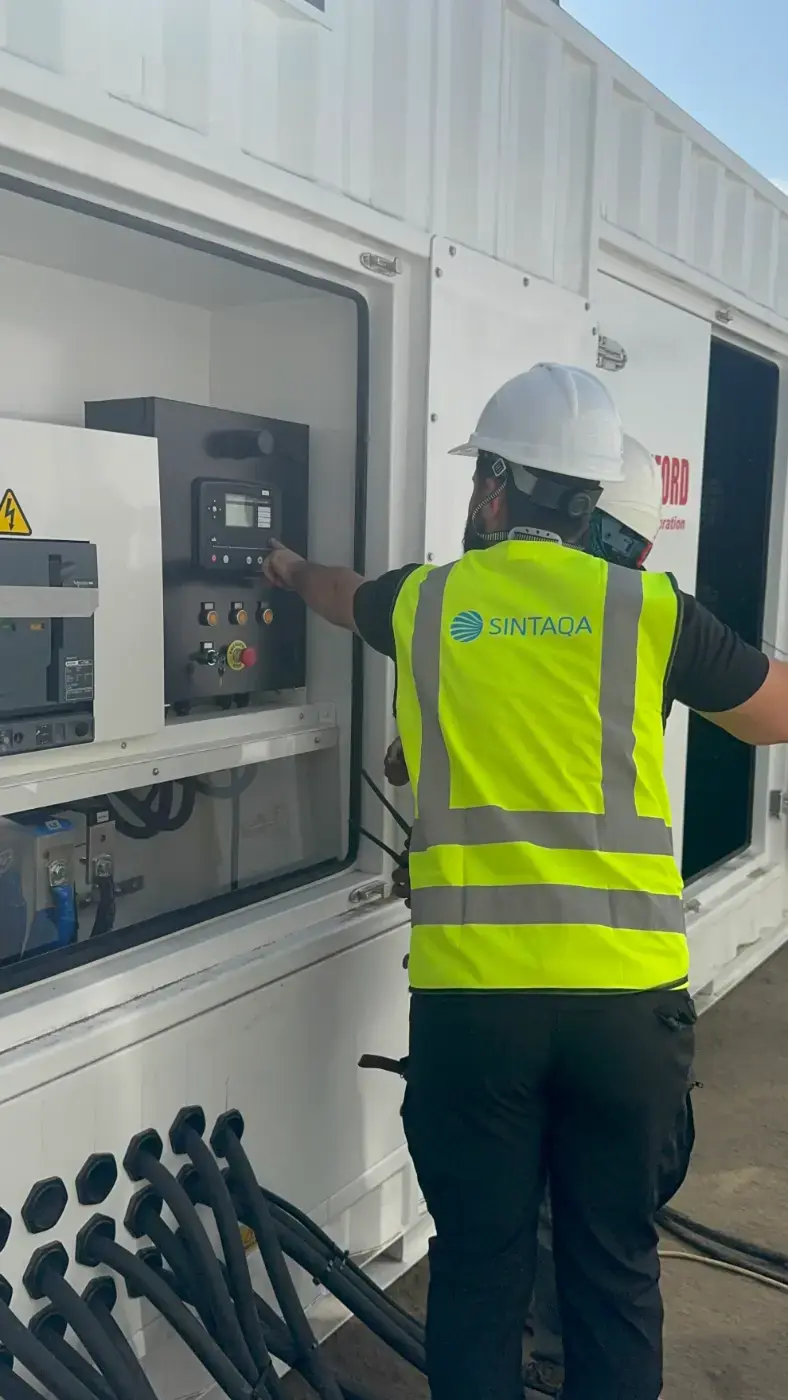 Service engineer at a walk-in generator container